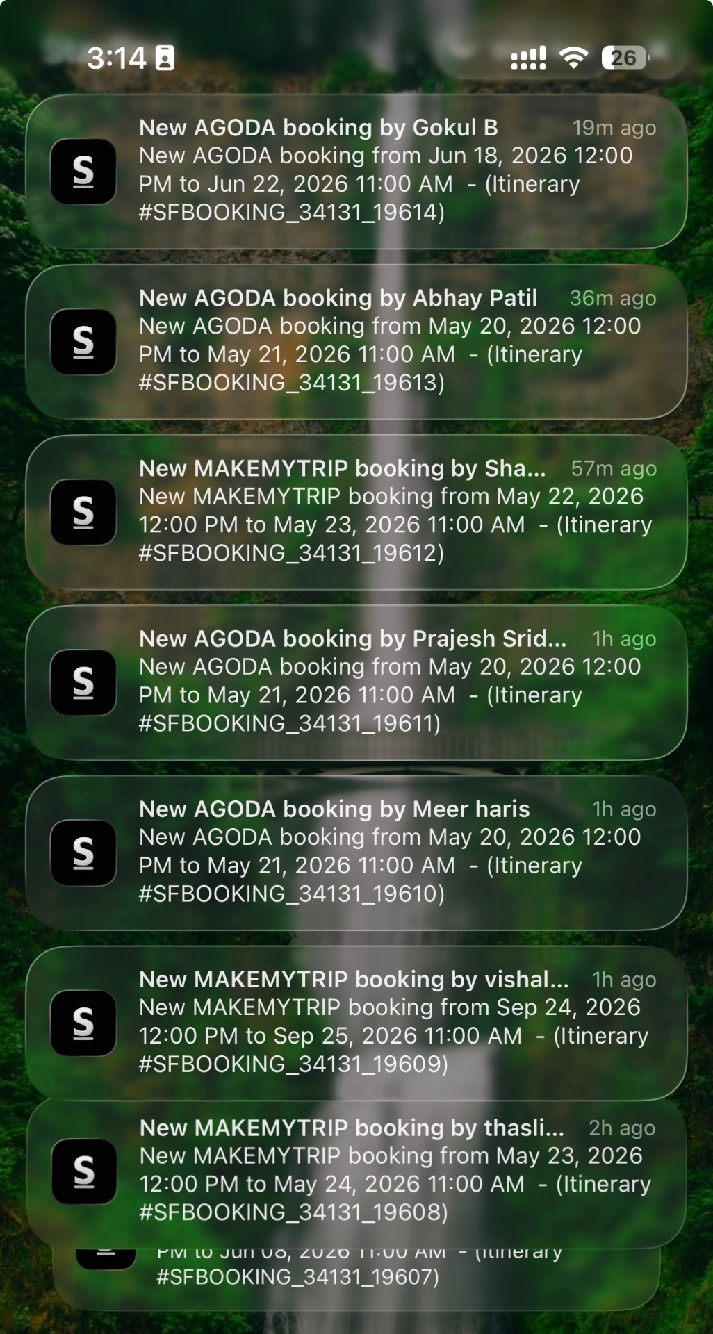 Phone notifications showing back-to-back AGODA and MAKEMYTRIP bookings
